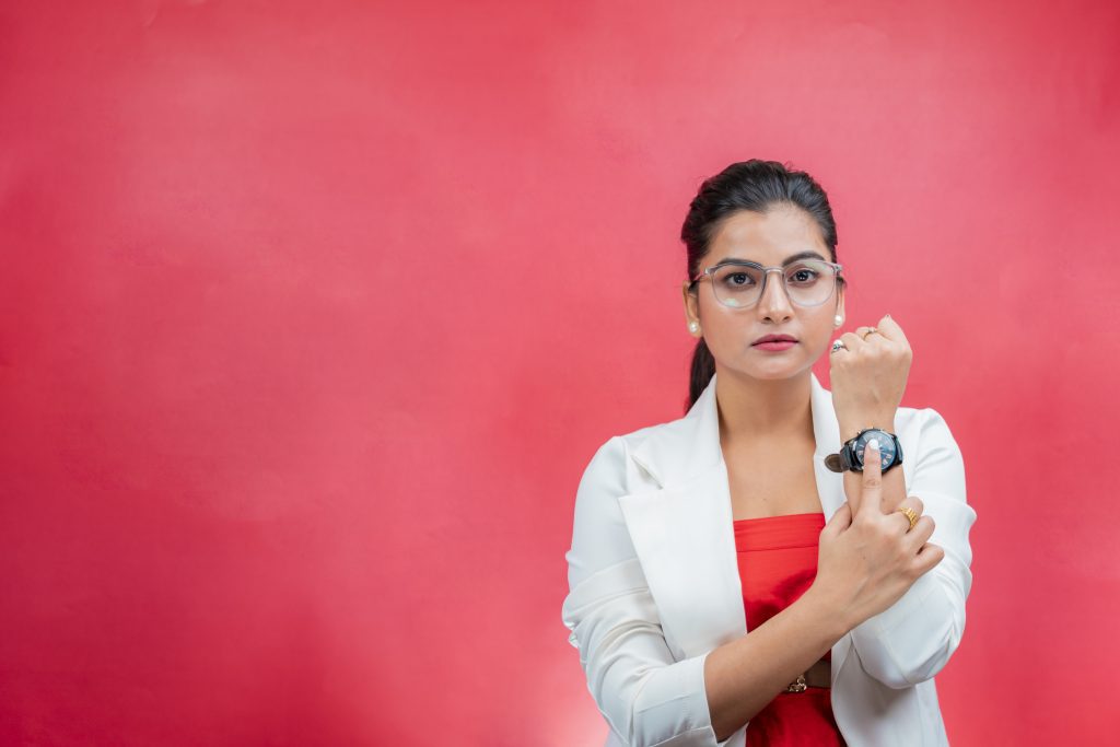 Confident woman showing wrist watch 23913 pixahive 1024x683